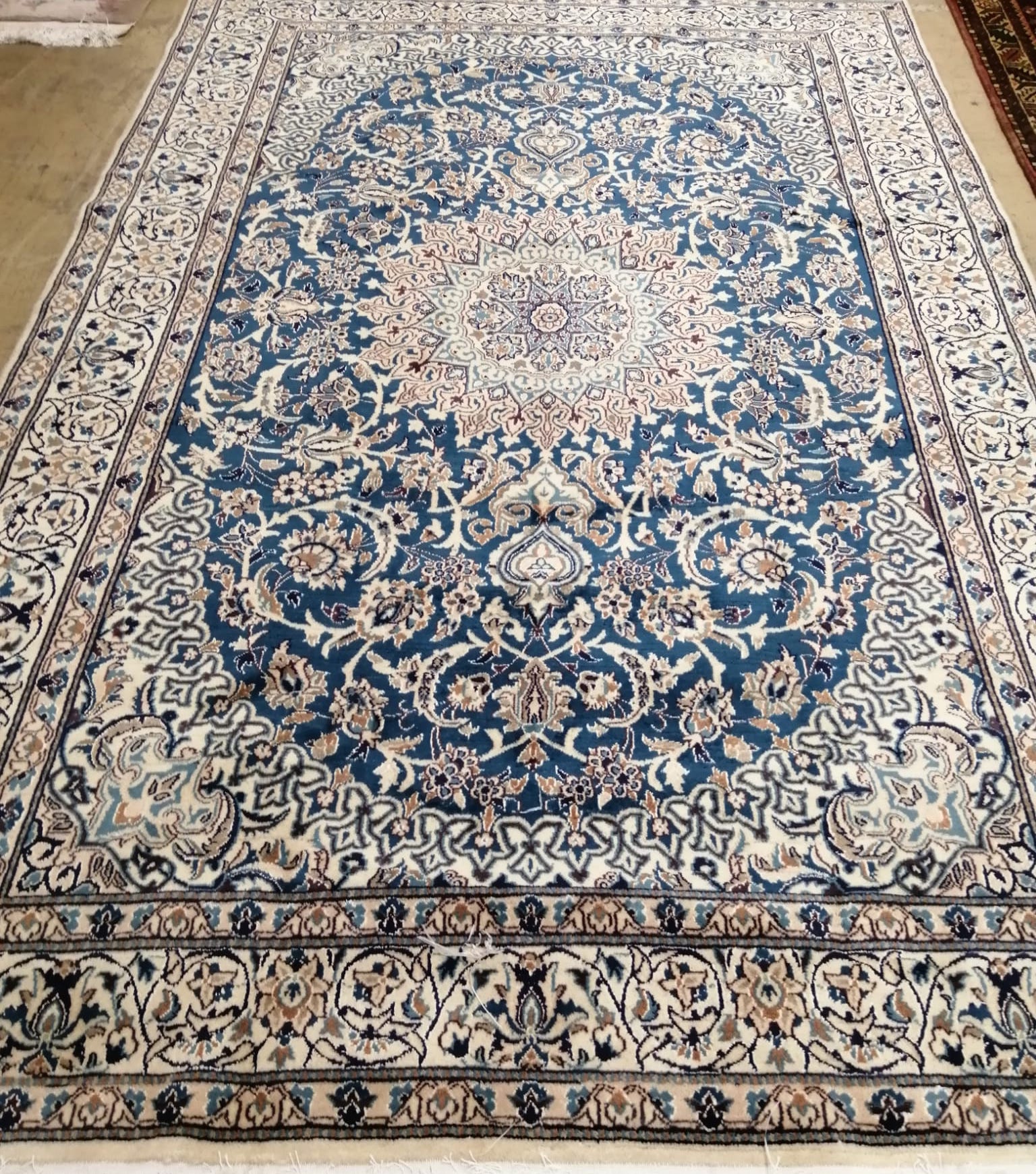 A Nain blue ground carpet, 285 x 205cm
